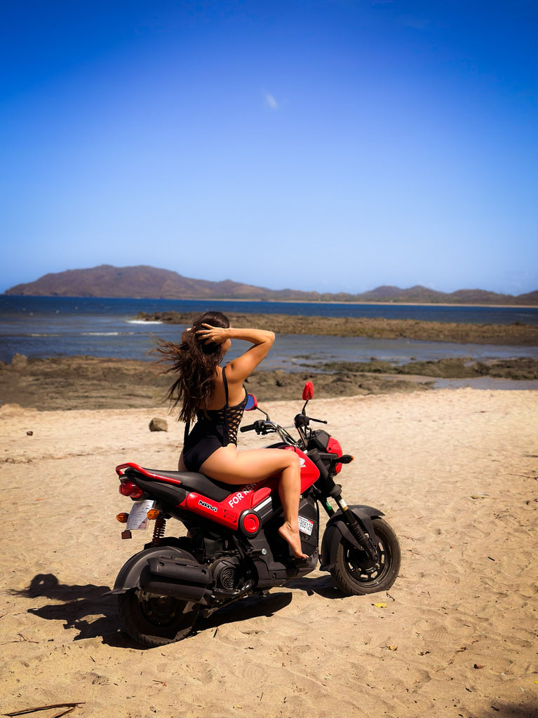 Ohana Rental Tamarindo Scooter With Female Rider At Playa Tamarindo